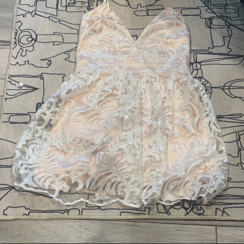 Sparkly cocktail dress with a cross back
